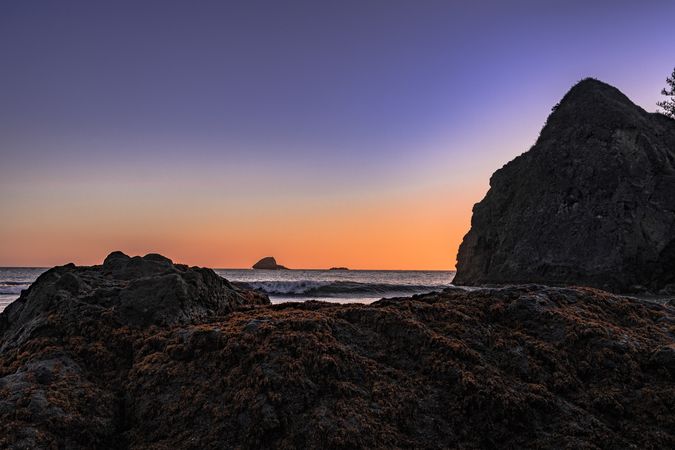 Pacific Ocean coast seen from cliffs with clear colorful at sunset