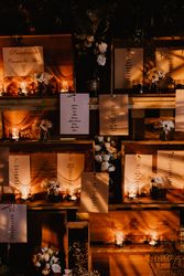 Wall with wedding decorations on shelves