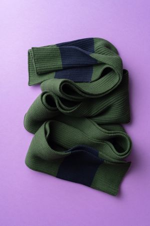 Green scarf on purple background