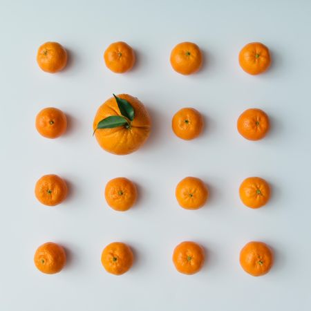 Pattern of tangerines and orange on light  background