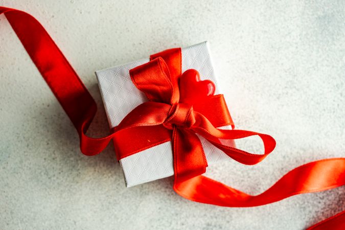 Present wrapped in red ribbon