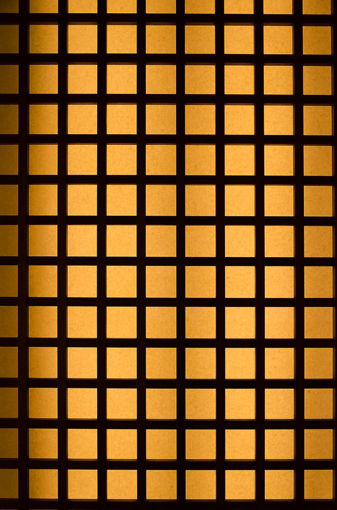 Orange light through wood square pattern