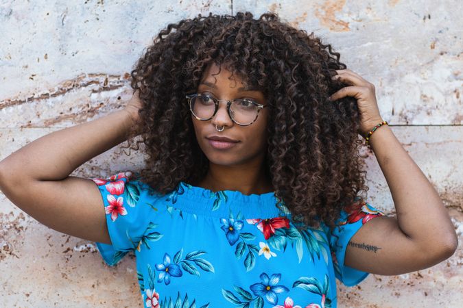 Trendy Black female near marble wall
