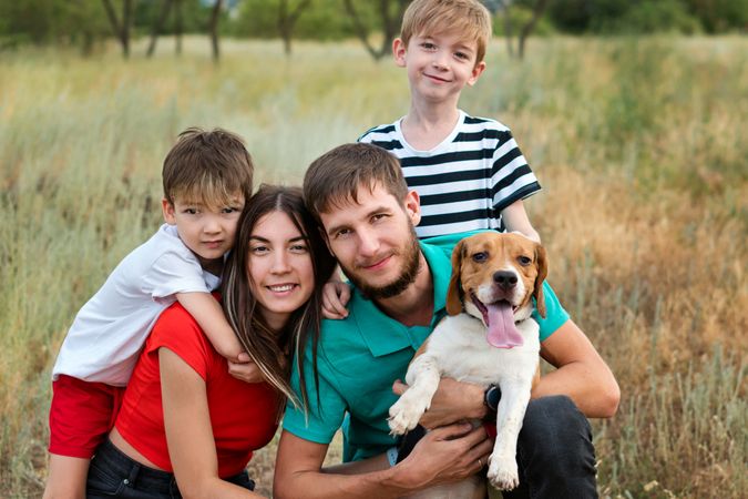Family walk and training dog
