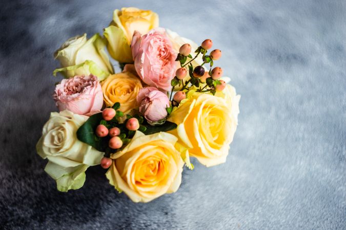 Fresh yellow & pink roses on counter
