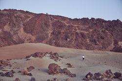Traveler in mountainous terrain in nature