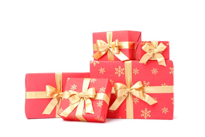 Gift boxes with golden bow isolated on blank background