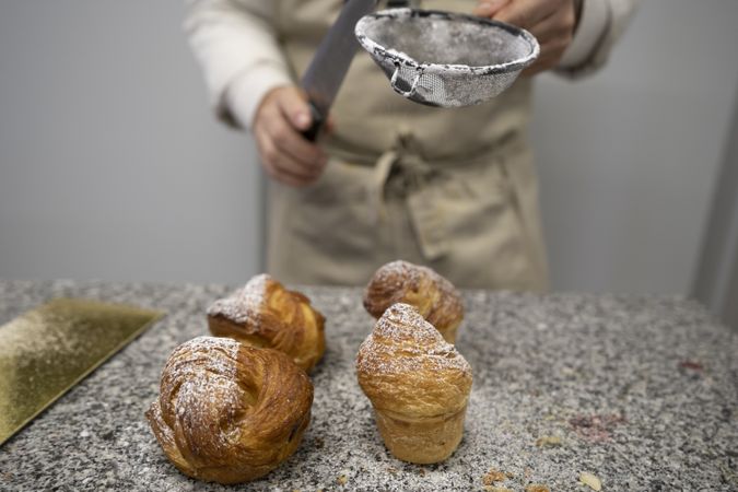 Cook sifting flour for dough