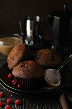 Composition with tasty muffins and cocoa drink on wooden background