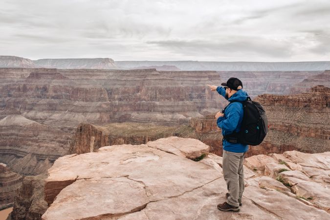 Calm male looking at pictorial landscape