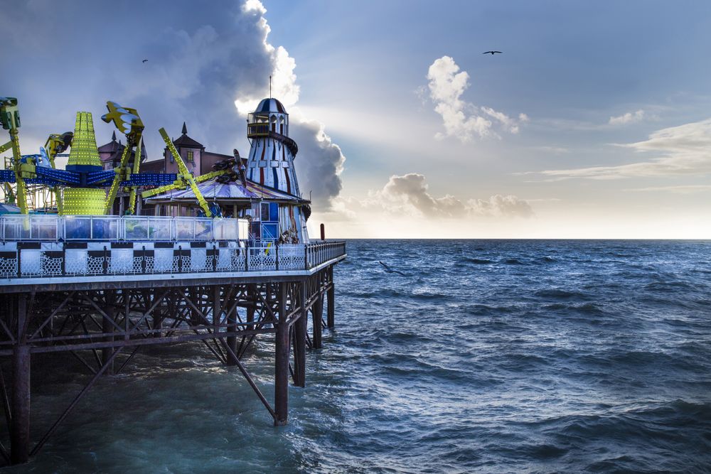 Amusement park on pier in evening