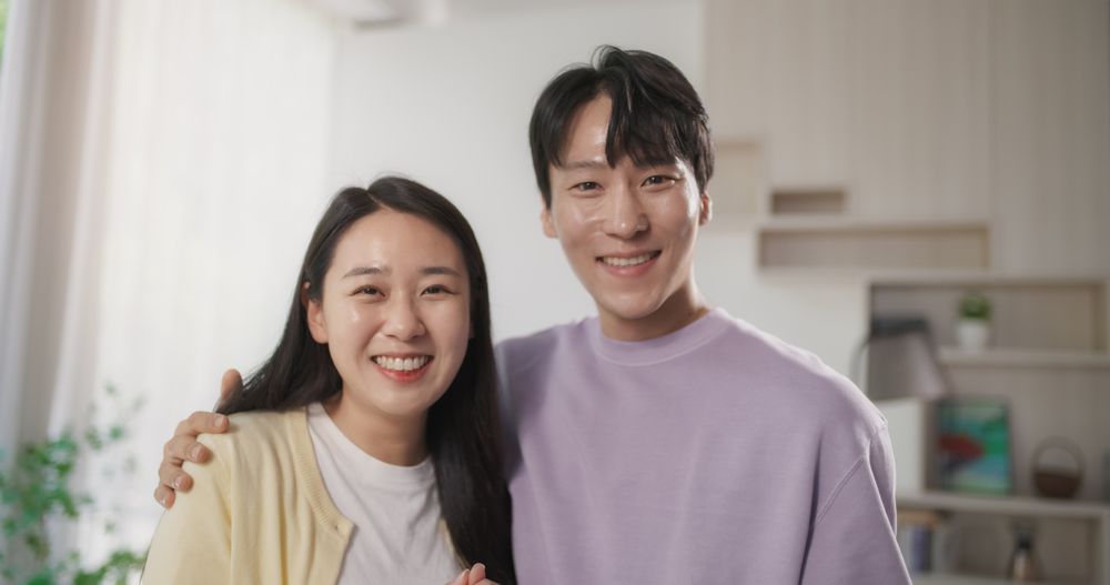 Asian Young Couple Cooking Delicious Food at Home.