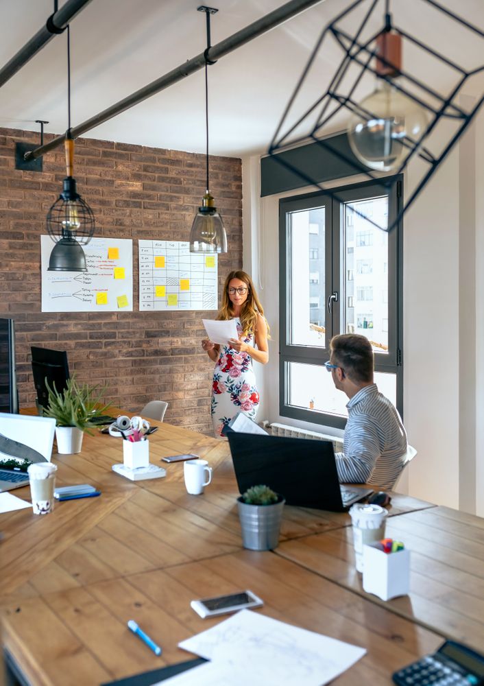 Manager reading documents in a meeting