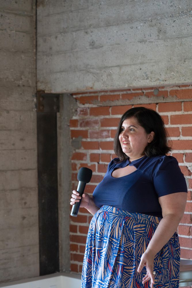 Woman public speaking with microphone