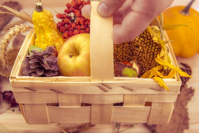 Rustic wooden basket with fall products