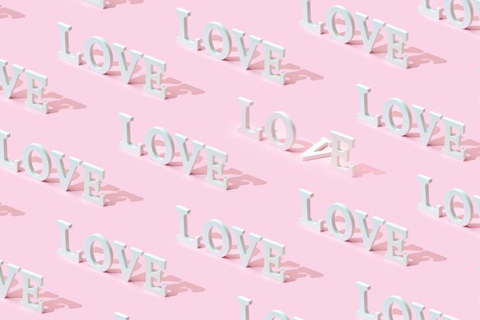 Pattern of the word “Love” on pink background