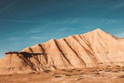 Desert cliffs under blue sky in landscape