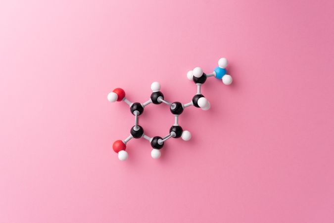 Molecular structure over pink background