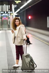 Arab woman in casual clothes with bag in subway station 5RlRrb