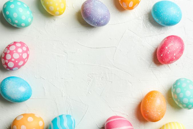 Decorated Easter eggs on color background. Space for text