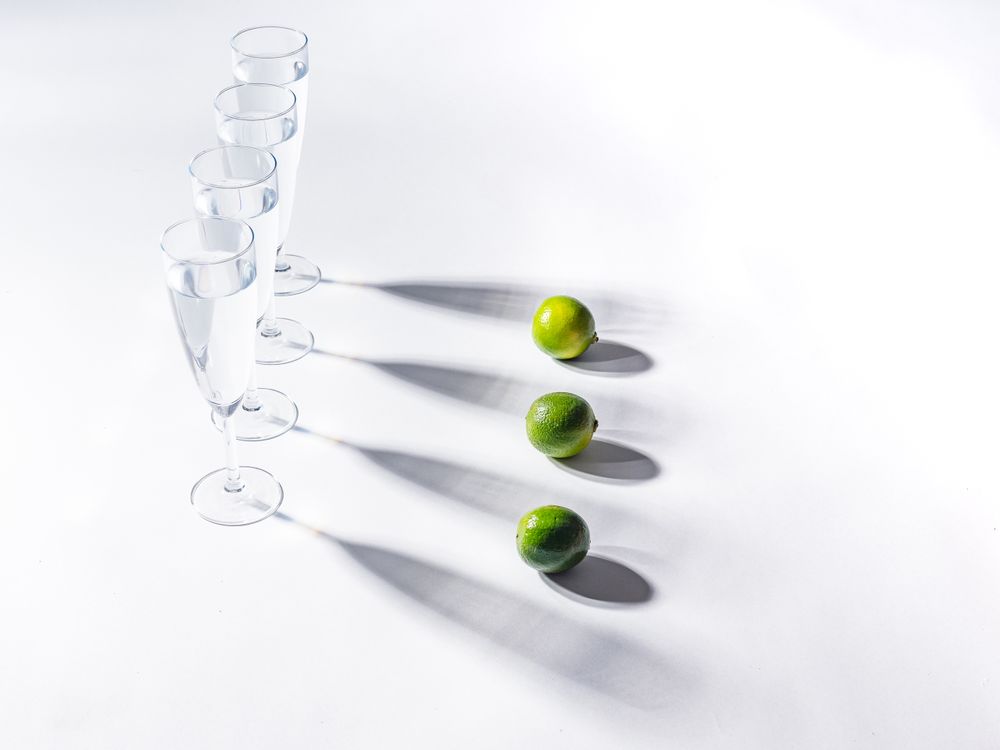 Creative composition of citrus and glasses of water