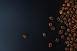 Scattered coffee beans on the side