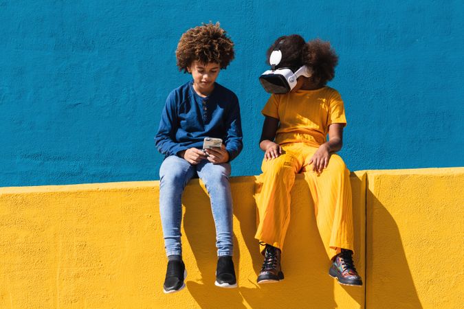 Black teenagers using modern gadgets