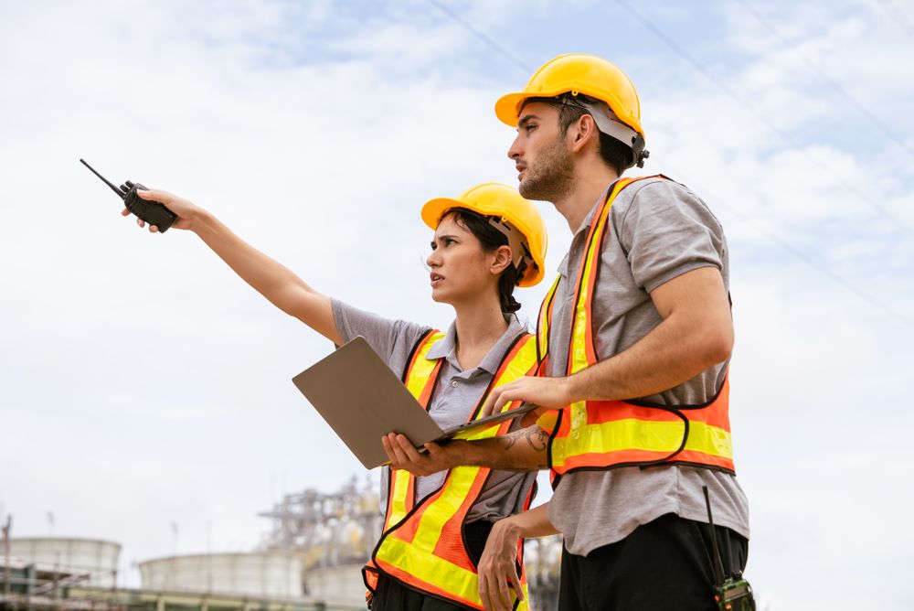 Engineer worker checking project at petrochemical factory or refinery oil plant industrial.