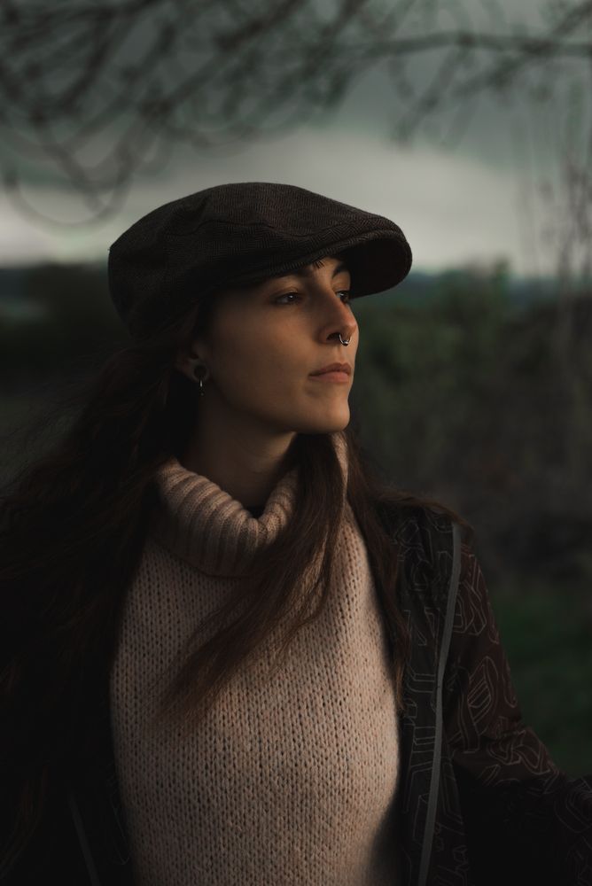 Young woman in warm clothes in forest