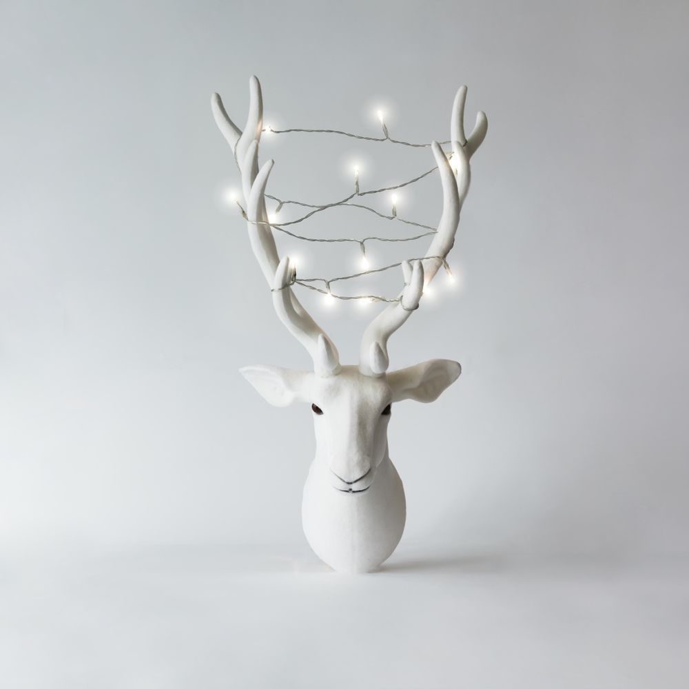 Christmas reindeer head with antlers with christmas lights
