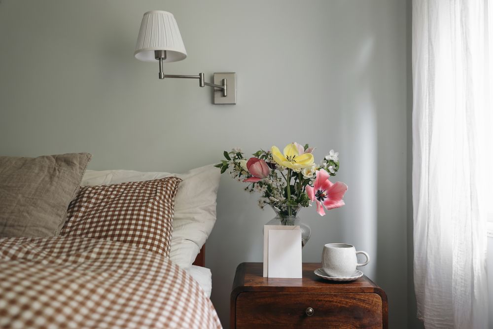 Spring interior still life. Blank vertical greeting card, invitation mockup in bedroom