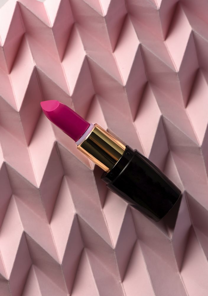 Lipstick on raised pink chevron. Product and make up concept