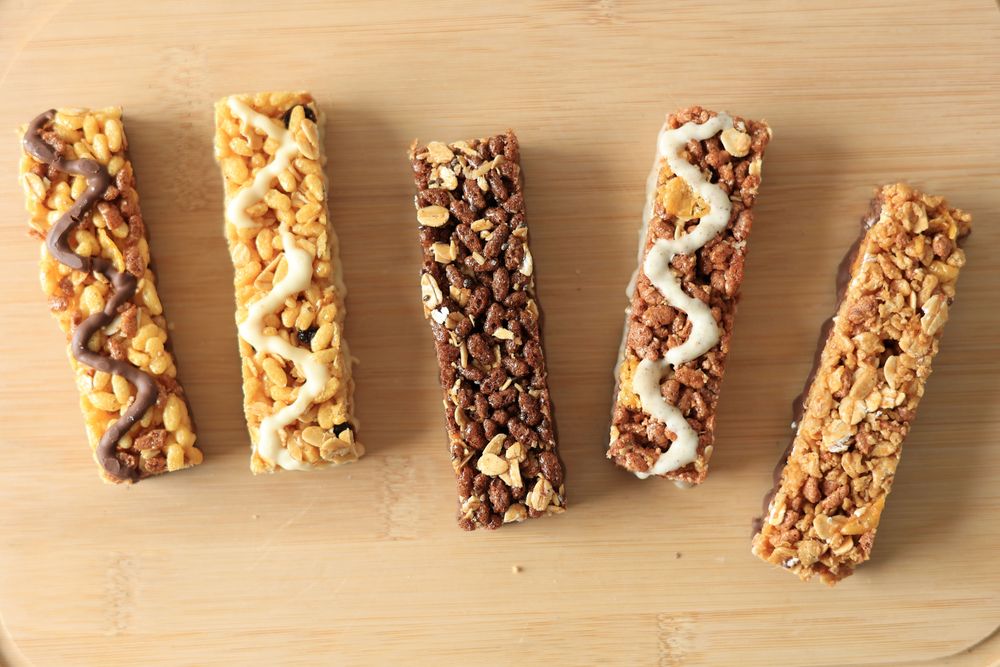 Various Healthy Cereal Granola Energy Bar on Wooden Background