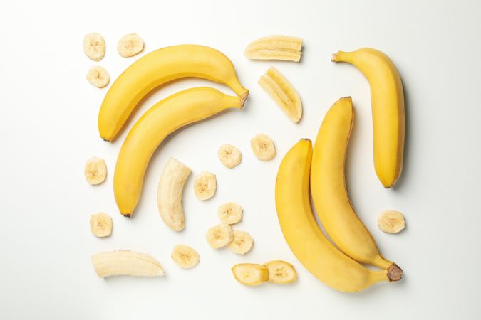 Flat lay with bananas on neutral background. Fresh fruit