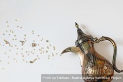 Traditional ornamental Arabic dallah coffee pot with bursting golden stars 41QVp4