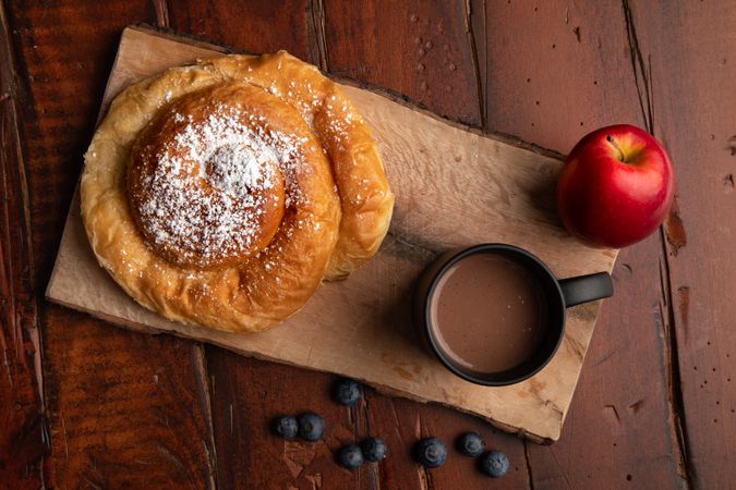 Breakfast food and drink on wooden table