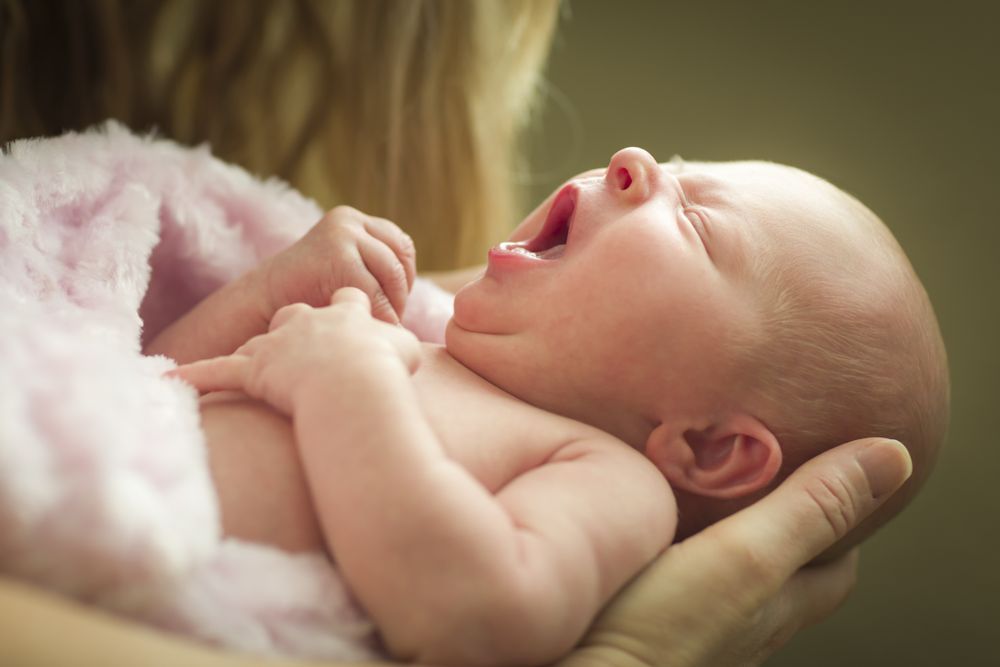 Mother Holding Her Newborn Baby Girl