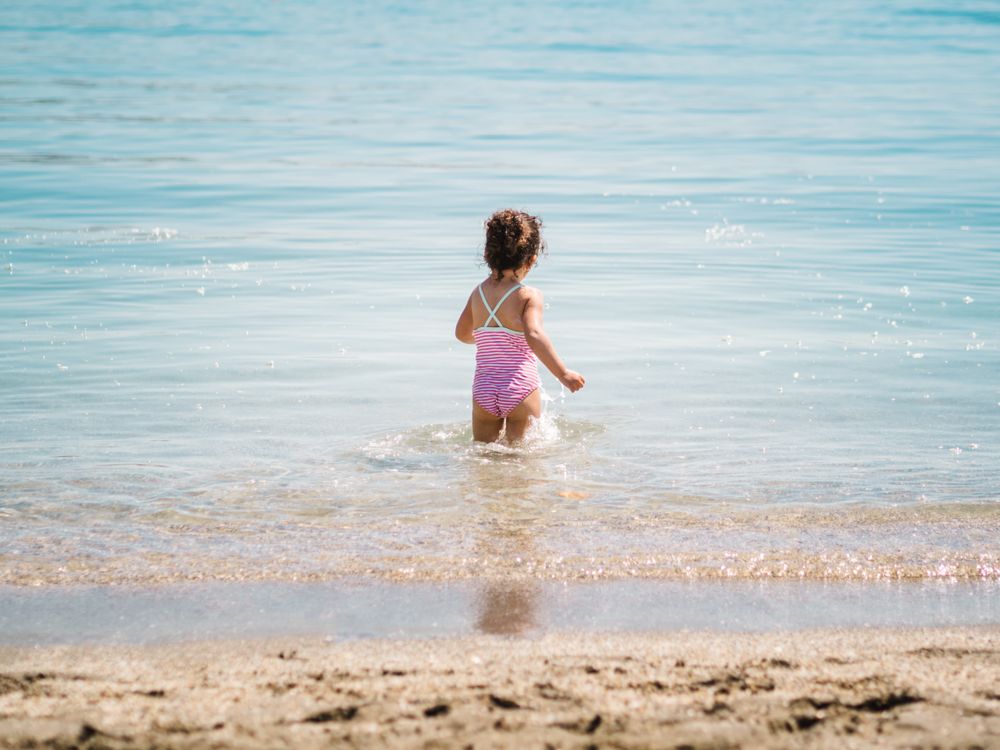 Cheerful girl having fun in warm sea