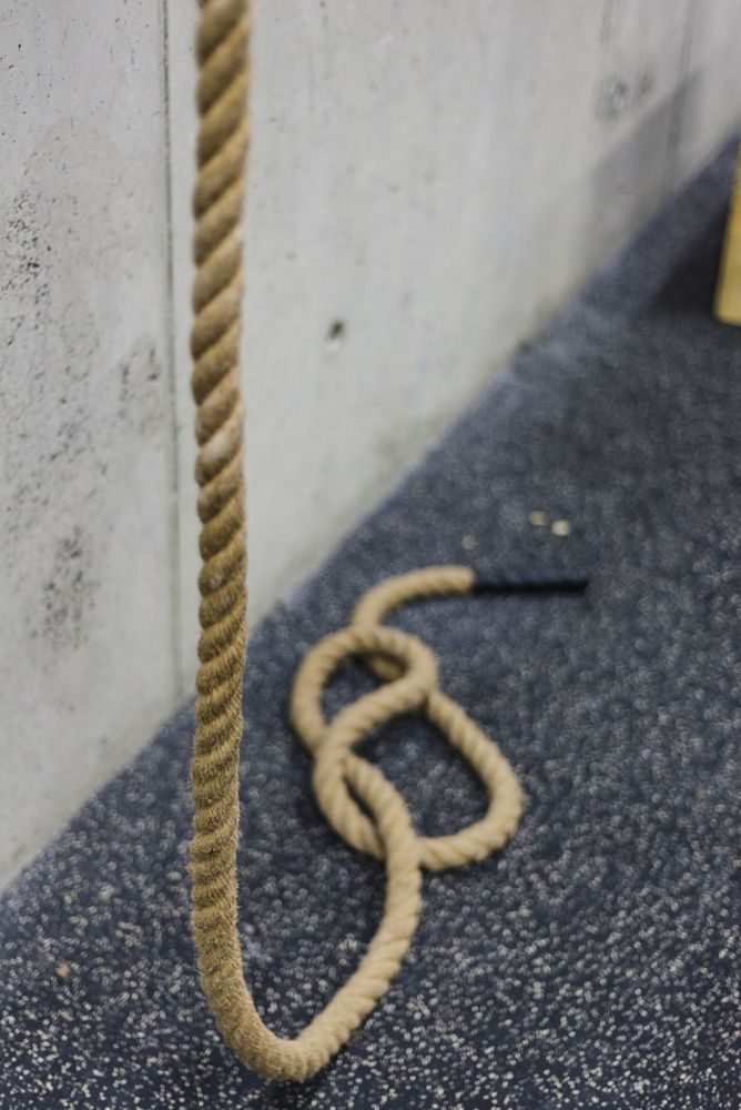 Rope hanging near wall in gym