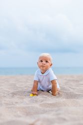 Blond baby on the beach