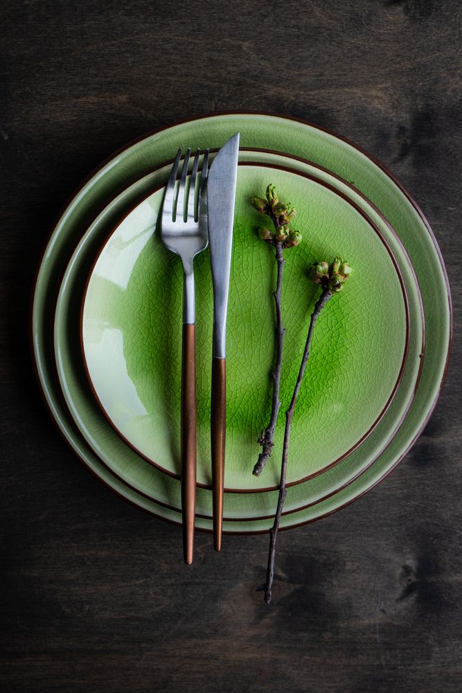 Green plate table setting with cherry blossom