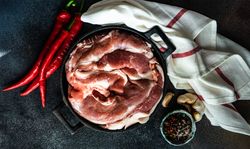 Top view of fresh raw pork ready to be cooked for dinner with space for text