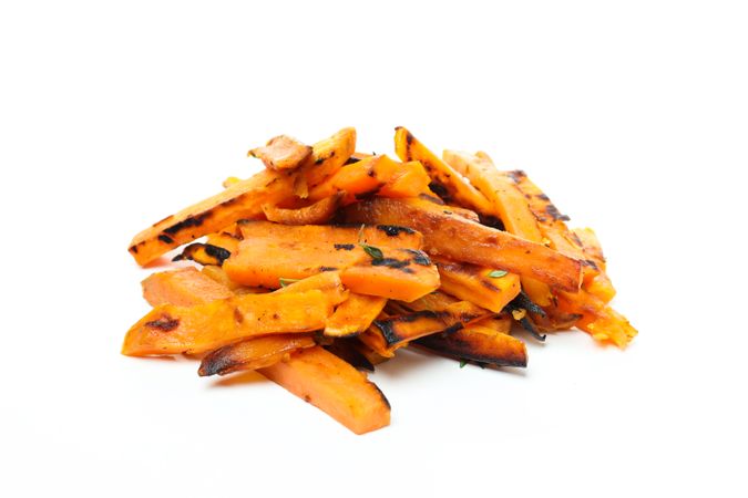 Concept of tasty food - sweet potato fries, isolated on light background