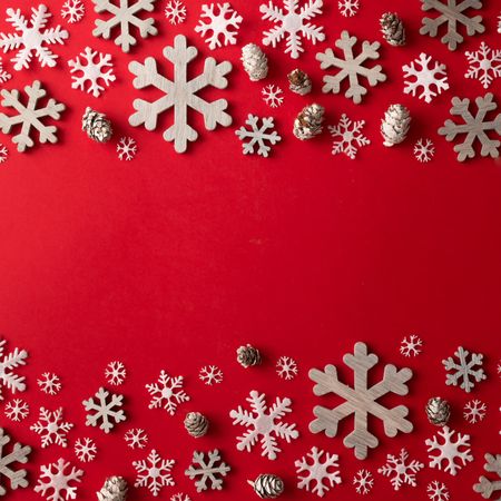 Snowflakes bordering red background
