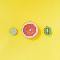 Tropical fruit on pastel yellow backround