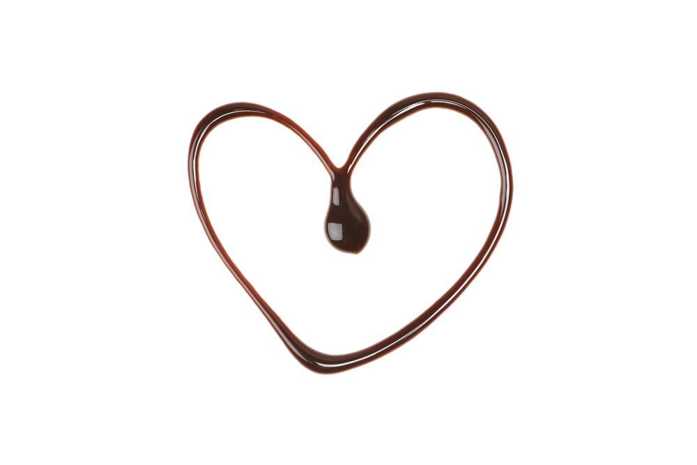 Heart made of melted chocolate isolated on blank background