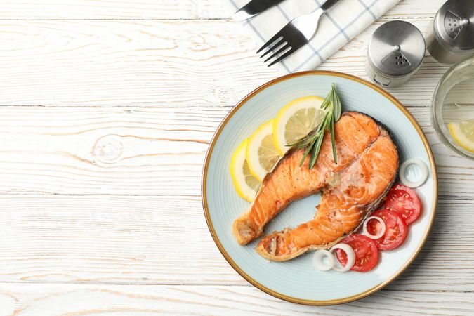 Composition with tasty grilled salmon on wooden background, top view
