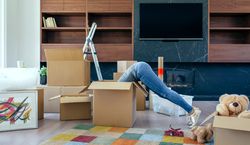 Woman inside a box preparing the move