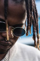Cool Black guy with dreadlocks in city center