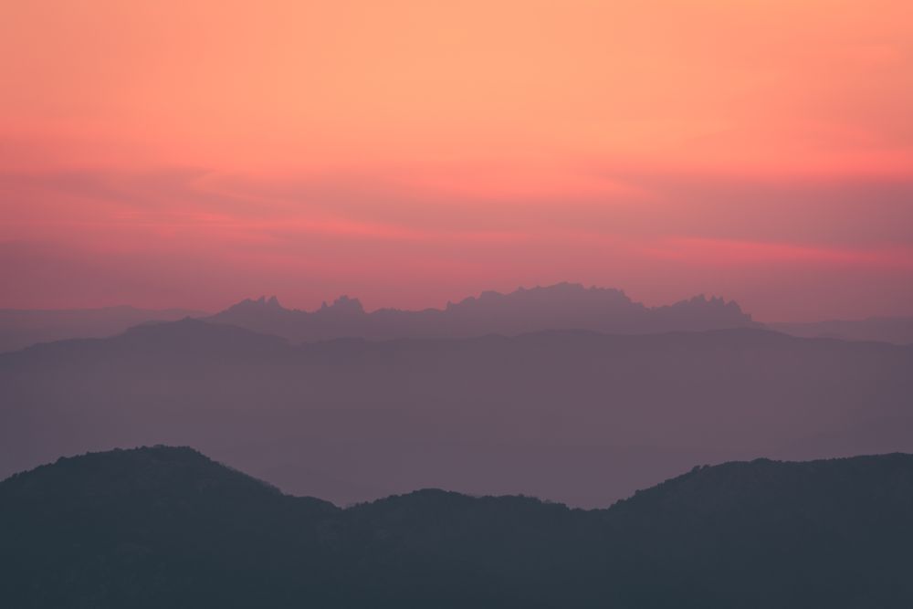 Sunset sky over mountain ridge